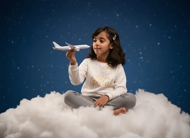 Arab Girl Holding Toy Airplane on Cloud Background