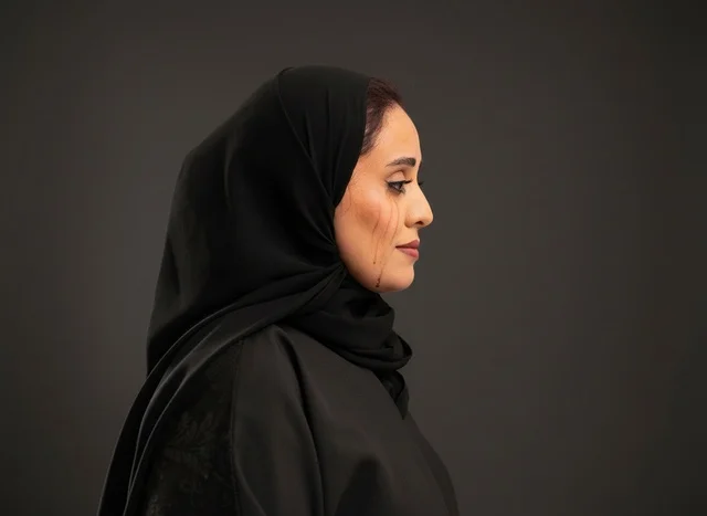 Saudi Woman in Black Abaya Side Profile Studio