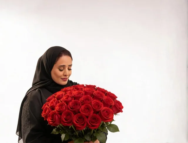 Saudi Woman in Black Abaya Holding Red Roses Bouquet