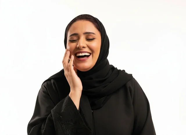 Saudi Woman in Black Abaya Laughing Studio Portrait