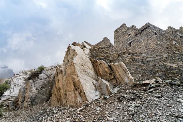 Traditional Stone Buildings on Rocky Mountain Landscape