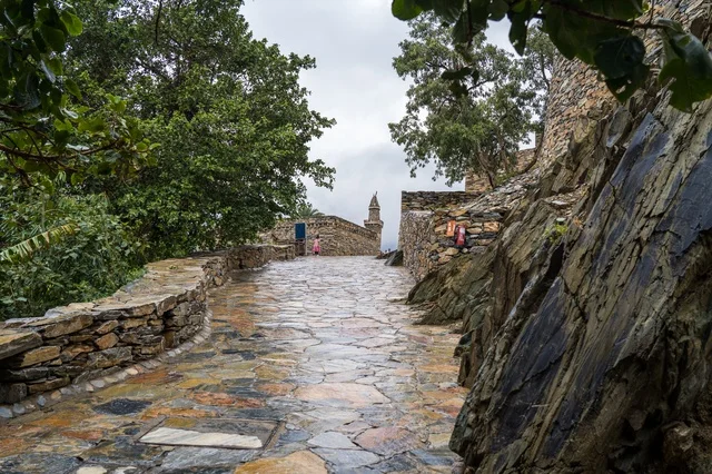 Traditional Saudi Stone Village Path in Rain