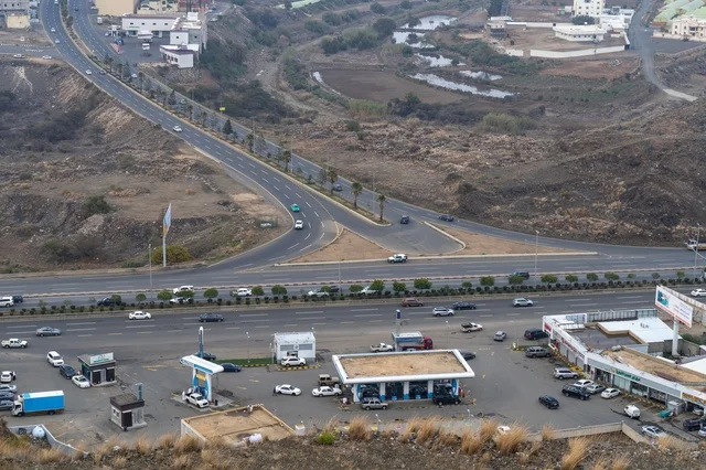 Aerial View of Urban Highway Intersection and Gas Station