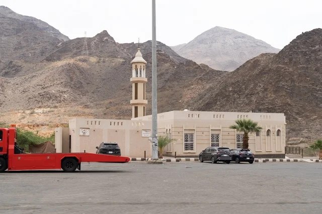 Small Mosque at Mountain Base with Parking Lot Small Mosque at Mountain Base with Parking Lot