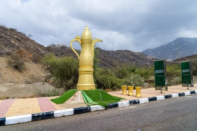 Golden Dallah Monument in Saudi Mountain Roadside