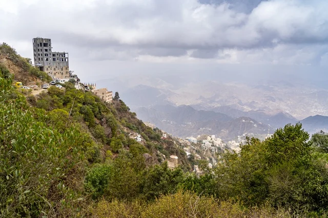 Stone Building on Mountain Ridge Overlooking Valley