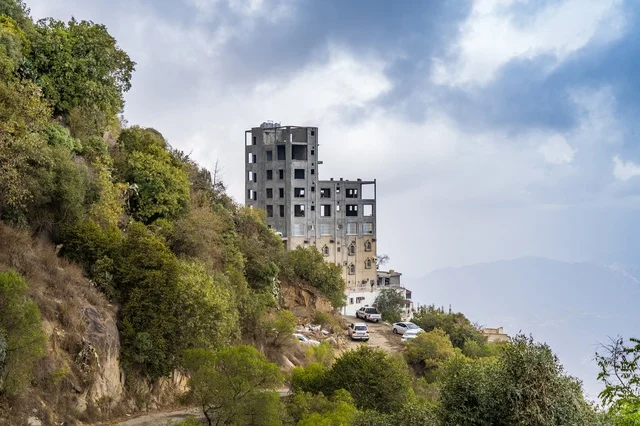 Unfinished Concrete Building on Green Mountain Hillside
