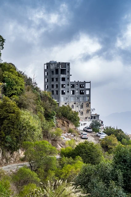 Unfinished Concrete Building on Green Mountain Hillside