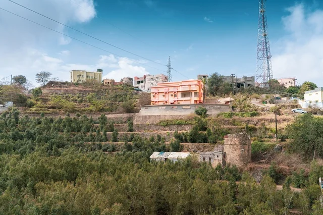 Mountain Hillside Houses and Rural Green Landscape