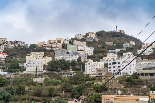 Mountain Residential Buildings under Cloudy Sky
