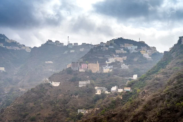 Residential Mountain Village Under Cloudy Sky