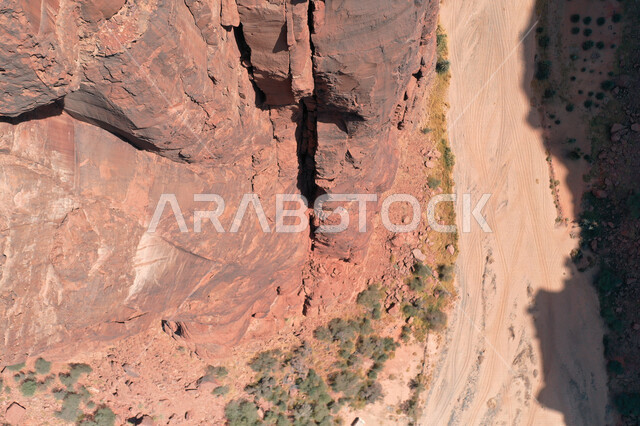 An aesthetic picture of the charming mountain canyons, rock formations and oases in Wadi Al-Disah in the Tabuk region, Wadi Al-Disah (the valley filled with palms) the charming nature and its scenic beauty in the Kingdom of Saudi Arabia