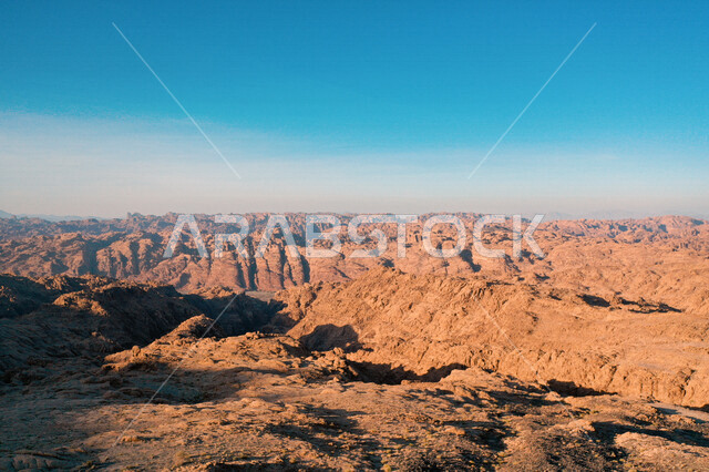 An aesthetic picture of the charming mountain canyons, rock formations and oases in Wadi Al-Disah in the Tabuk region, the charming nature and its scenic beauty in the Kingdom of Saudi Arabia