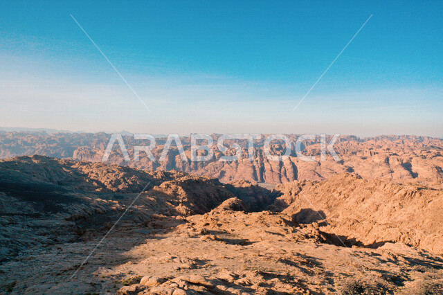 An aesthetic picture of the charming mountain canyons, rock formations and oases in Wadi Al-Disah in the Tabuk region, the charming nature and its scenic beauty in the Kingdom of Saudi Arabia