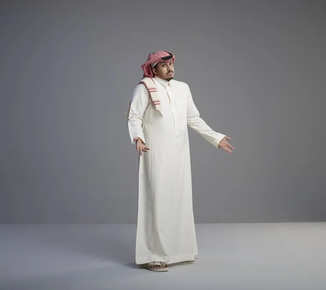 Saudi Man in Traditional Thobe Shrugging in Studio