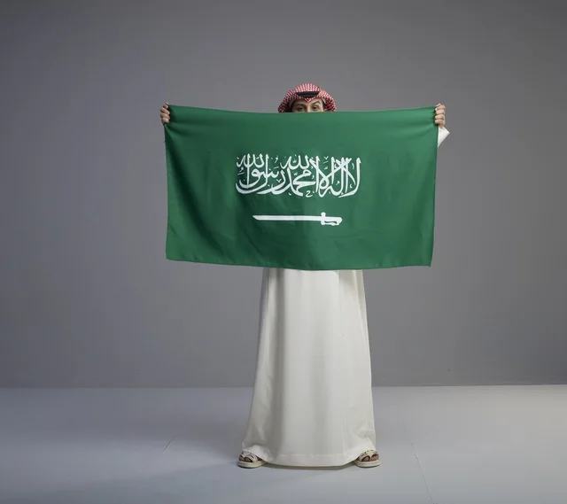 Saudi Man Holding Saudi Arabia National Flag Studio Shot