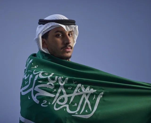 Saudi Man Wrapped in National Flag Portrait
