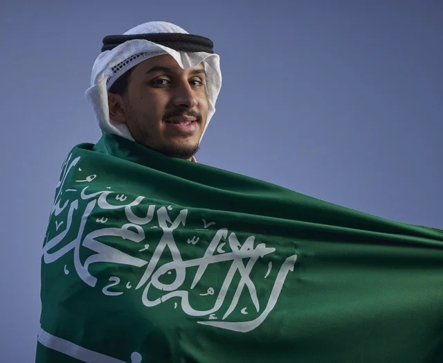 Saudi Man Wrapped in Flag Saudi Arabia National Day