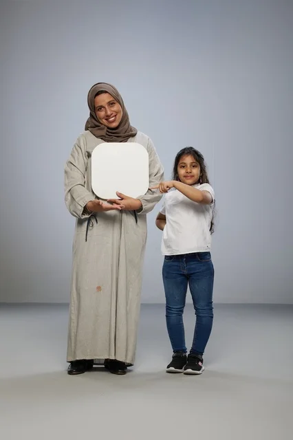 Saudi Mother and Daughter with Blank White Board
