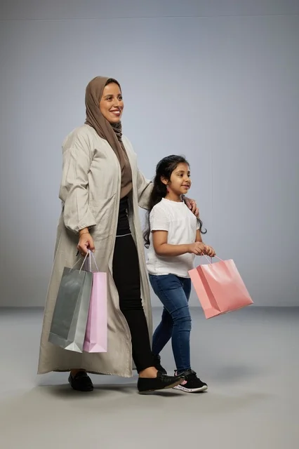 Saudi Mother and Daughter with Shopping Bags