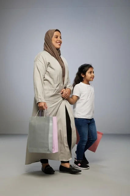 Saudi Mother and Daughter with Shopping Bags