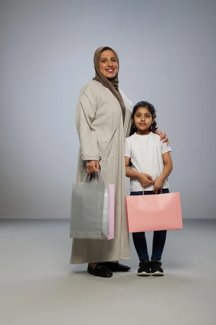 Saudi Mother and Daughter with Shopping Bags