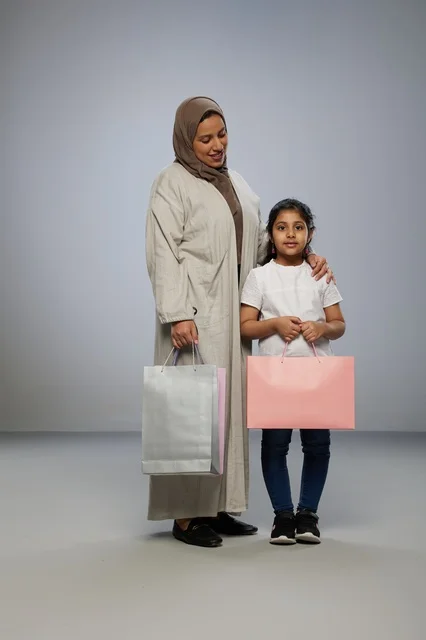 Saudi Mother and Daughter with Shopping Bags