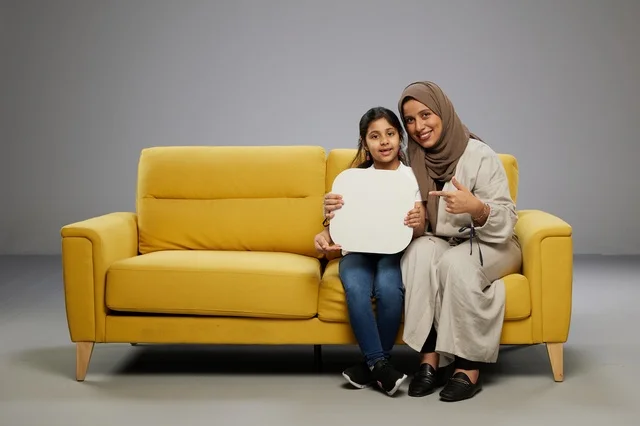 Saudi Mother and Daughter Holding Blank White Mockup