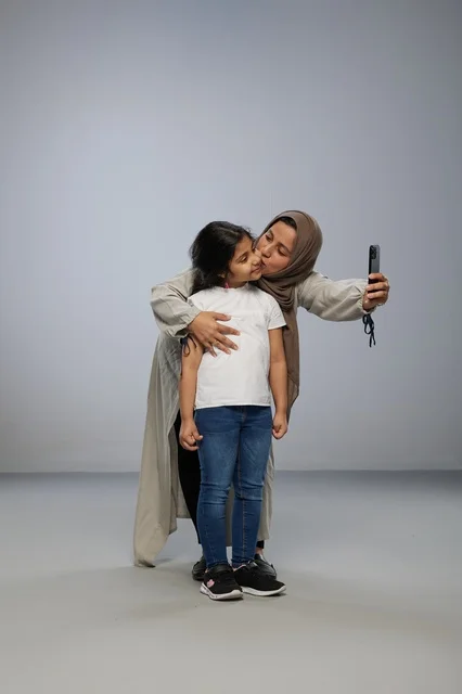 Saudi Mother Taking Selfie With Daughter in Studio