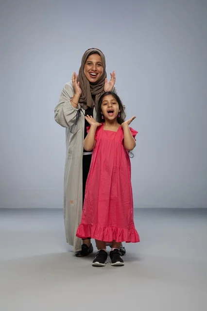 Saudi Mother and Daughter Joyful Studio Portrait
