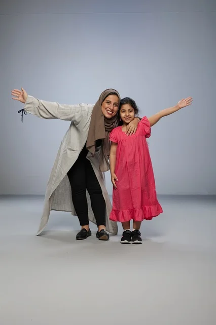 Saudi Mother and Daughter Posing in Studio