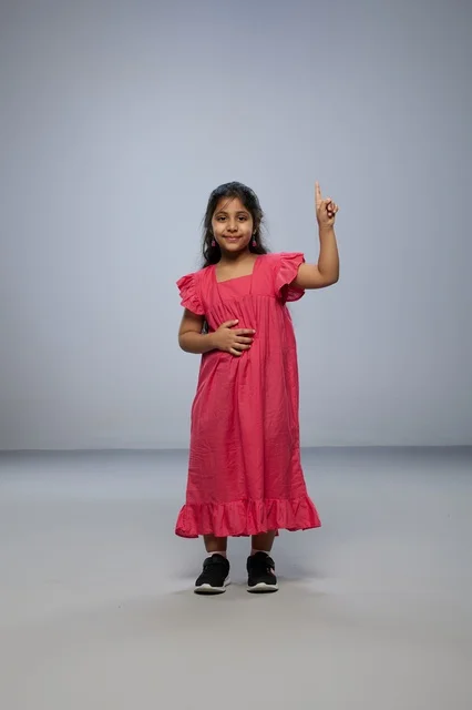 Saudi Girl in Pink Dress Pointing Finger Upward