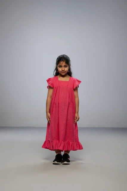 Saudi Girl in Pink Dress on Grey Studio Background