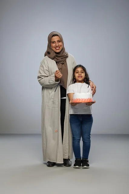 Saudi Mother and Daughter with Birthday Cake