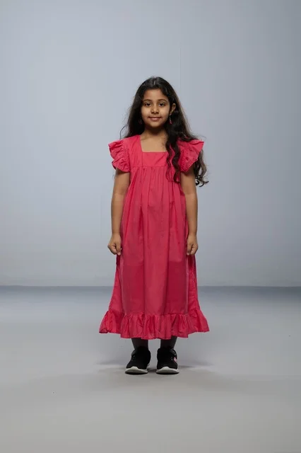 Saudi Girl Standing in Pink Dress Studio Portrait