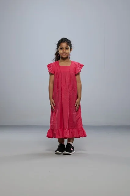 Saudi Girl Wearing Pink Dress in Studio Portrait