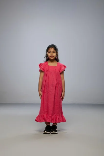 Saudi Girl Wearing Long Pink Dress in Studio Portrait