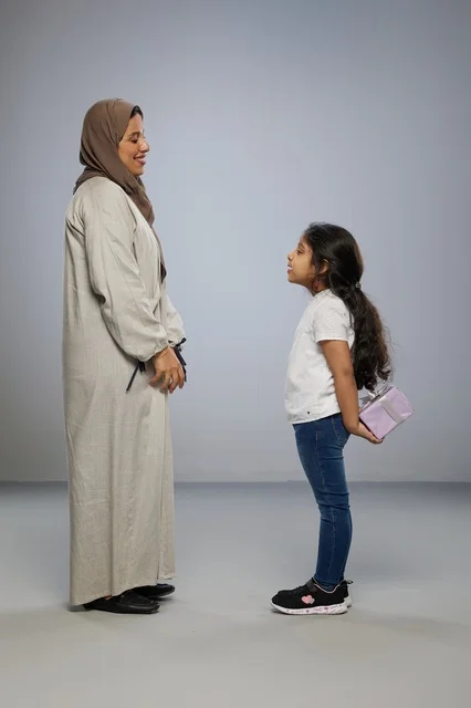Arab Girl Hiding Gift for Mother in Studio Shot