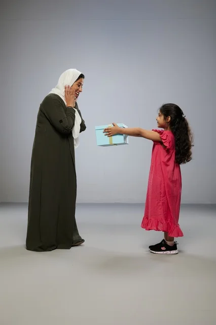 Mother and Daughter with Gift Box in Studio