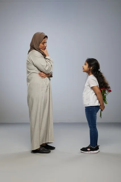 Arab Girl Hiding Red Roses for Mother in Studio