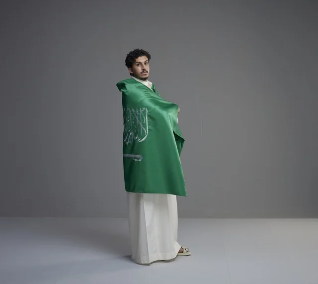 Saudi Man Wrapped in National Flag in Studio