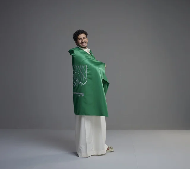 Saudi Man Wrapped in National Flag in Studio