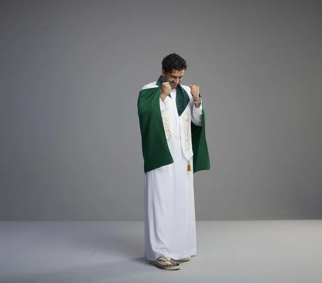 Saudi Man Celebrating With National Flag Studio Shot