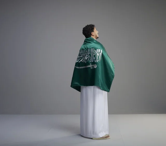 Saudi Man Wrapped in National Flag in Studio