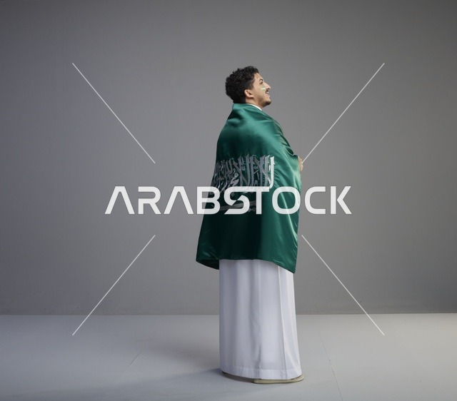 Saudi Man Wrapped in Flag for National Day Studio