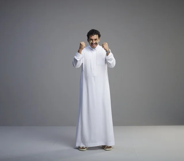 Saudi Man Celebrating Victory in White Thobe
