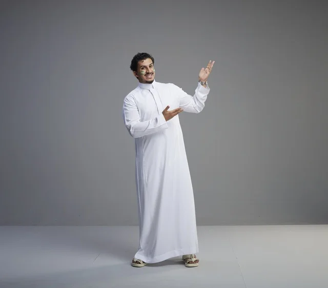 Saudi Man with Face Paint Gesturing for National Day