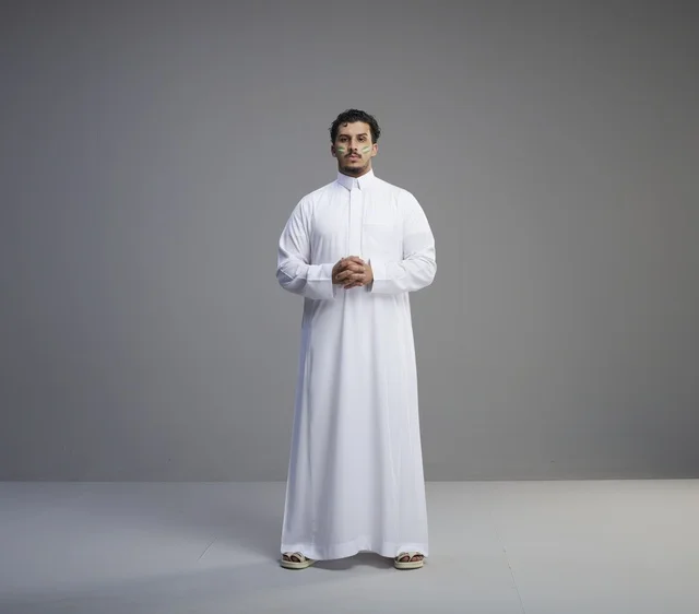 Saudi Man in Traditional Thobe Celebrating National Day