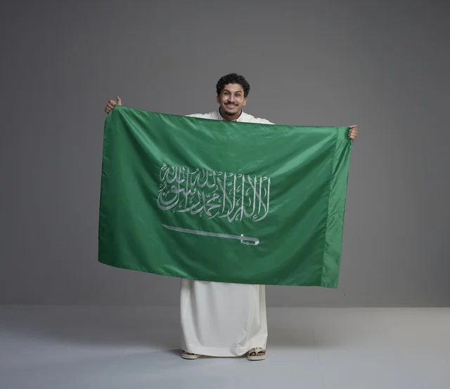 Saudi Man Holding National Saudi Arabia Flag