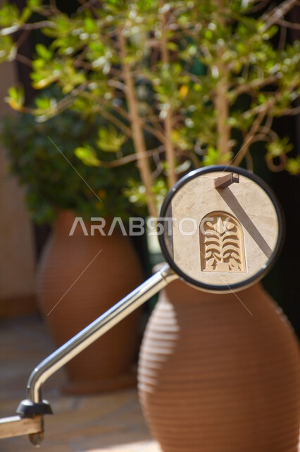 Close-up of side mirror, cart mirror, large pottery, landscape background